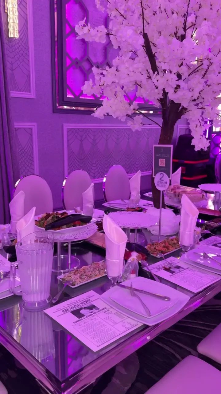 Cherry blossom centerpiece above a set reception table