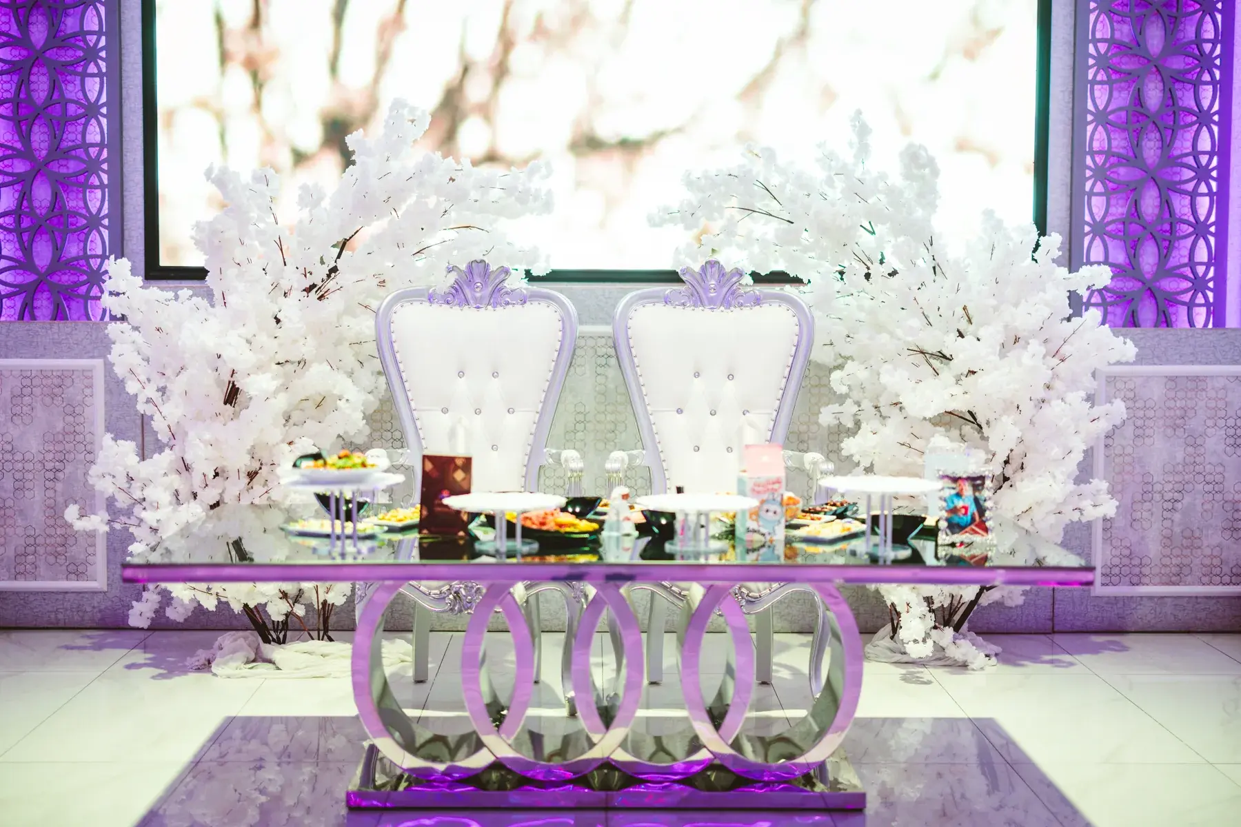 Blossom arch behind the sweetheart table